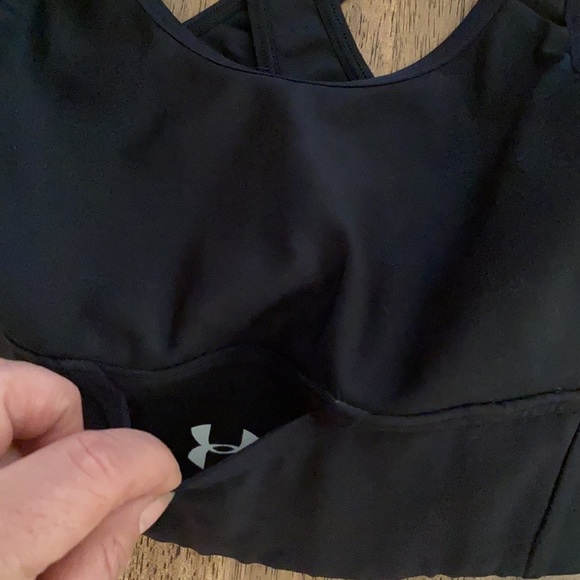 Under armour black sports bra with an adorable pocket in front. - Picture 4 of 8